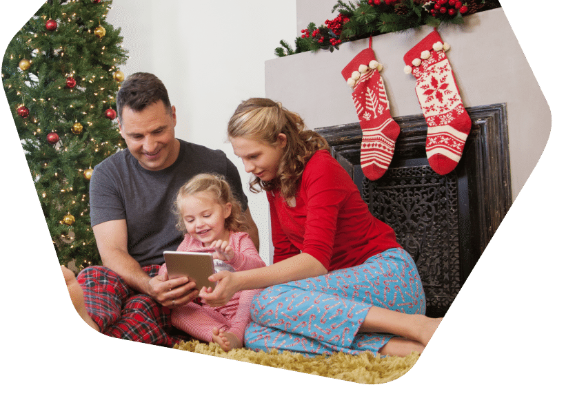 Happy couple smiling while browsing on a laptop