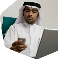 Man using mobile and computer