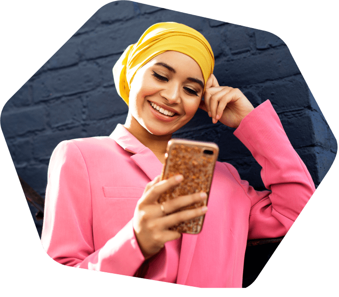 Woman smiling using her mobile phone
